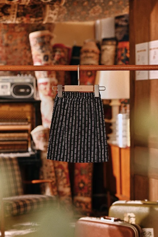 The Akar Kita Babies Folded Skirt - Black Streak leather skirt refined